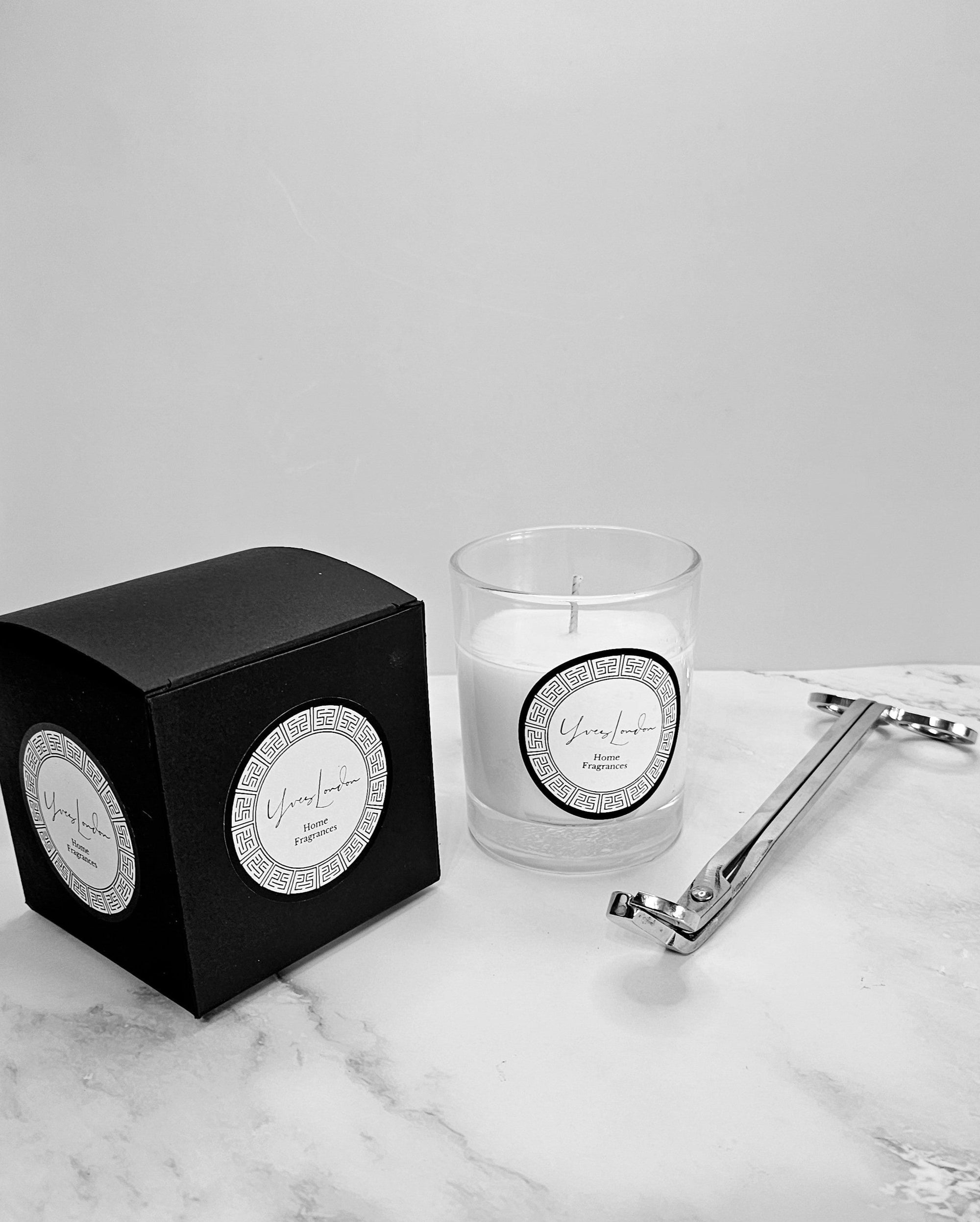 Amber & Orange Candle in a sleek clear jar with  lid, featuring a warm amber and zesty orange fragrance blend.